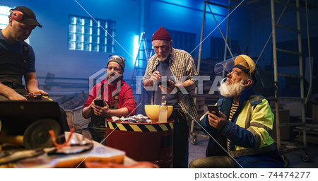 Men making online bets and discussing match 74474277