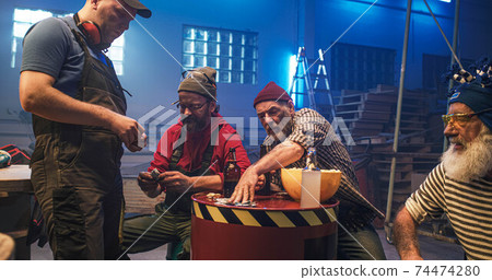 Male friends making bets while watching match 74474280