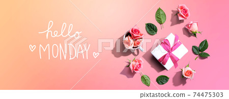 Hello Monday message with a gift box and roses 74475303