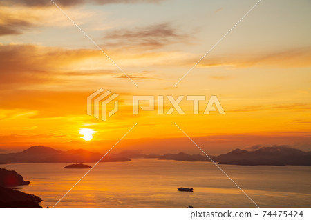 Asahi rising from the beauty of the islands of Setouchi from Noroyama Hachimakiyama Observatory 74475424