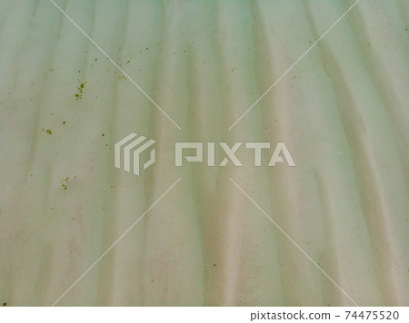 Aerial Shot of Low Tide Sea Bottom Sand Waves Pattern. Long Shallow Indian Ocean Shoal Aerial Shot of Low Tide Sea Bottom Sand Waves Pattern. Long Shallow Indian Ocean Shoal 74475520