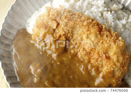 Hot cutlet curry with a large pork cutlet in the middle (overhead view) Hot cutlet curry with a large pork cutlet in the middle (overhead view) 74476098