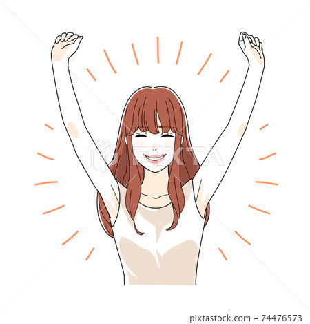 A woman in her twenties who is happy to raise her hand 74476573
