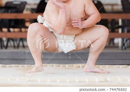 Sumo wrestler practicing sumo wrestling Sumo wrestler practicing sumo wrestling 74476882