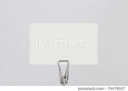 Clip with a white paper card 74479567