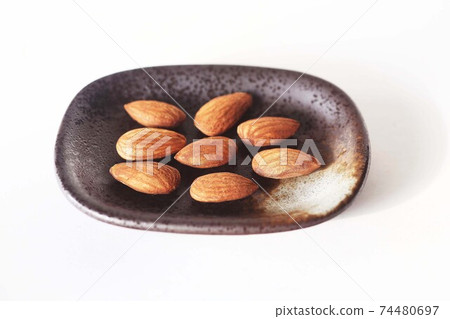 Almonds made from fruit seeds Almonds made from fruit seeds 74480697