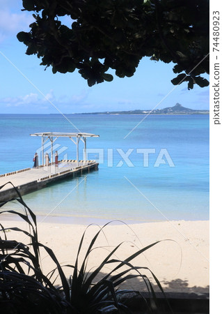 Ie Island in the emerald green blue sea seen from the Bise coast in Motobu Town, Okinawa Prefecture 74480923