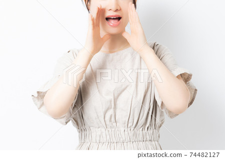 Young woman calling out aloud 74482127