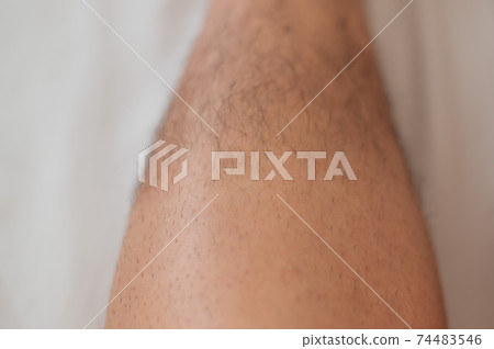 Close-up of a shaved half male leg. Close-up of a shaved half male leg. 74483546