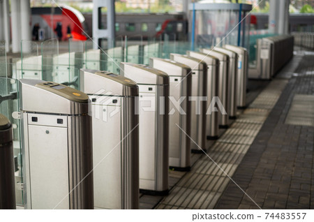 Empty turnstiles at a railway station. Empty turnstiles at a railway station. 74483557