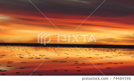 Sunset with a spectacular view of Uyuni salt lake 74484398