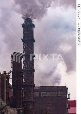Environmental issues. Air pollution. Smoke emission. vertical photo. 74488014