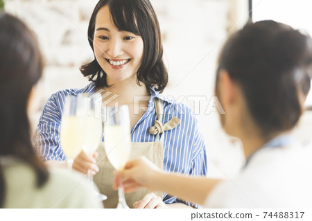 A woman toasting A woman toasting 74488317
