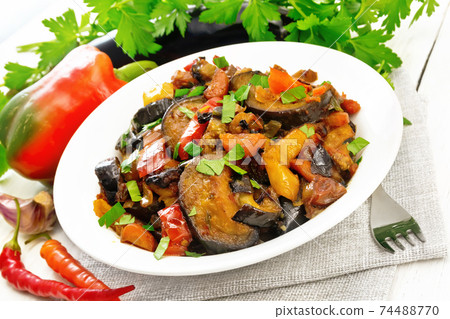 Ragout with eggplant and pepper on board Ragout with eggplant and pepper on board 74488770