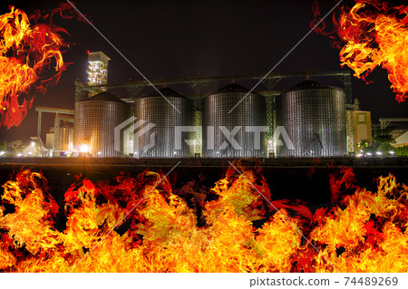 Agricultural Silos burned out at night time. Agricultural Silos burned out at night time. 74489269