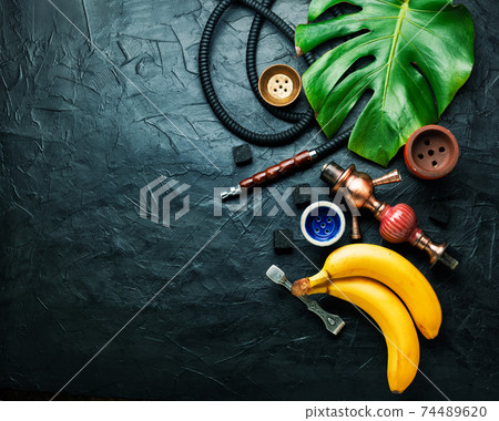 Smoking shisha with banana tobacco 74489620