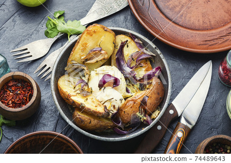 Baked potatoes with cheese Baked potatoes with cheese 74489643