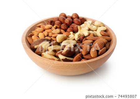 Bowl with different nuts isolated on white background 74493807