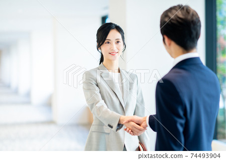 Business woman shaking hands "LINK FOREST" shooting cooperation 74493904