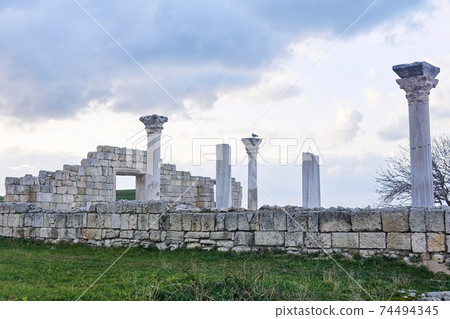 ruins of antique greek basilica with columns against a winter sky ruins of antique greek basilica with columns against a winter sky 74494345