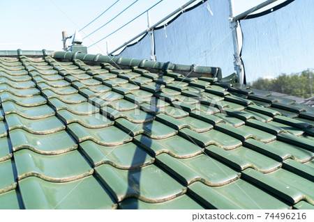 Roof tiles that need repair Roof tiles that need repair 74496216