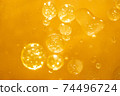 golden yellow bubble oil droplet, abstract background 74496724
