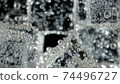 ice cube in fizzy splashing water with soda bubble 74496727