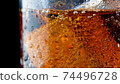 ice cube in fizzy splashing water with soda bubble 74496728