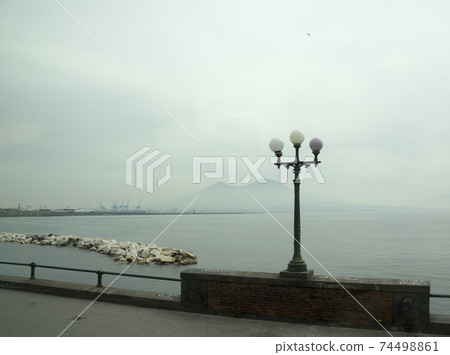 NAPLES,ITALY- April 03,2014 :View of Mount Vesuvius from Naples. Italy NAPLES,ITALY- April 03,2014 :View of Mount Vesuvius from Naples. Italy 74498861
