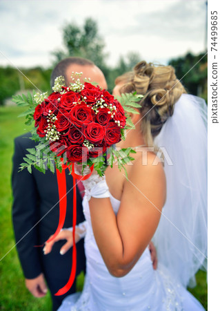 nice wedding bouquet in bride's hand nice wedding bouquet in bride's hand 74499685