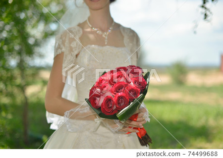 nice wedding bouquet in bride's hand 74499688