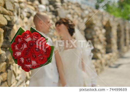 nice wedding bouquet in bride's hand nice wedding bouquet in bride's hand 74499689