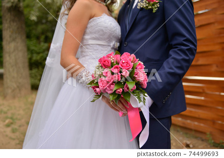 nice wedding bouquet in bride's hand nice wedding bouquet in bride's hand 74499693
