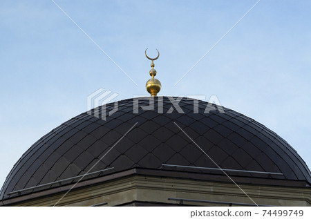 View of dome of mosque with a crescent and star. The Ar-Rahma Mosque View of dome of mosque with a crescent and star. The Ar-Rahma Mosque 74499749