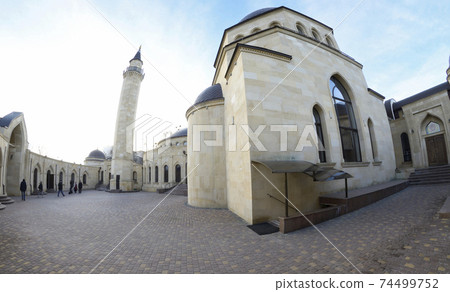 View of courtyard of the Ar-Rahma Mosque (Mercy Mosque) with building of the mosque itself, minaret, and domes View of courtyard of the Ar-Rahma Mosque (Mercy Mosque) with building of the mosque itself, minaret, and domes 74499752