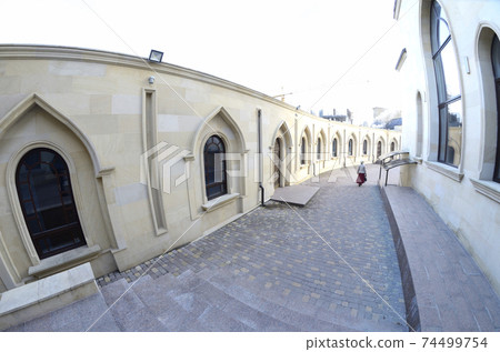View of courtyard of the Ar-Rahma Mosque (Mercy Mosque) with building of the mosque itself, minaret, and domes 74499754