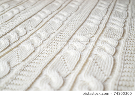 Knitted woolen pattern of symmetric ornament lines Knitted woolen pattern of symmetric ornament lines 74500300