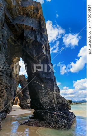 Natural arches on beach. Natural arches on beach. 74500934
