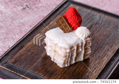 Beautiful colorful bright soap made in the form of an appetizing cake Beautiful colorful bright soap made in the form of an appetizing cake 74501174