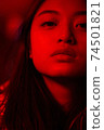 Teenager hipster girl in bright vibrant neon light 74501821
