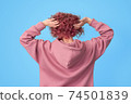 Back of young woman with pink hair 74501839
