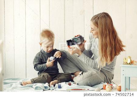 Mother with son at home prepare to easter Mother with son at home prepare to easter 74502714