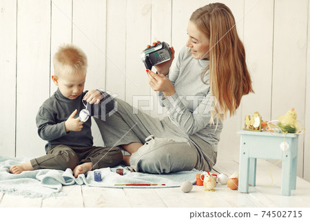 Mother with son at home prepare to easter Mother with son at home prepare to easter 74502715