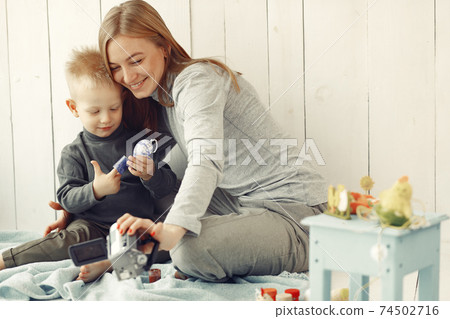 Mother with son at home prepare to easter 74502716