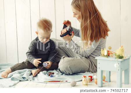 Mother with son at home prepare to easter Mother with son at home prepare to easter 74502717