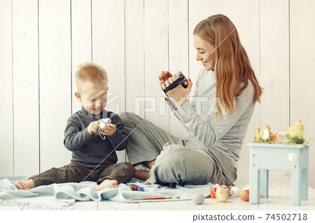 Mother with son at home prepare to easter 74502718