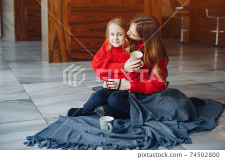 Beautiful mother with a little daughter Beautiful mother with a little daughter 74502800
