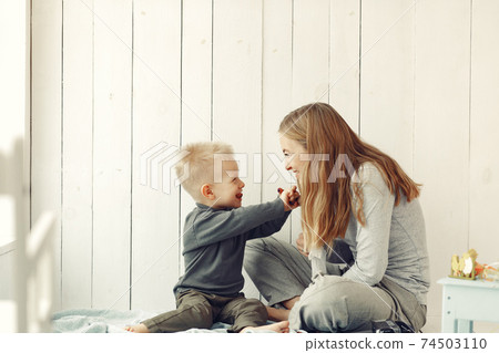 Mother and little son playing at home 74503110