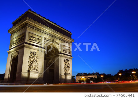 The Arc de Triomphe at night illuminated in Paris, France 74503441