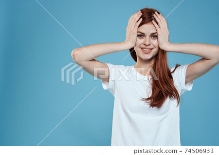 pretty woman white tshirt long hair glamor lifestyle cropped view blue background 74506931